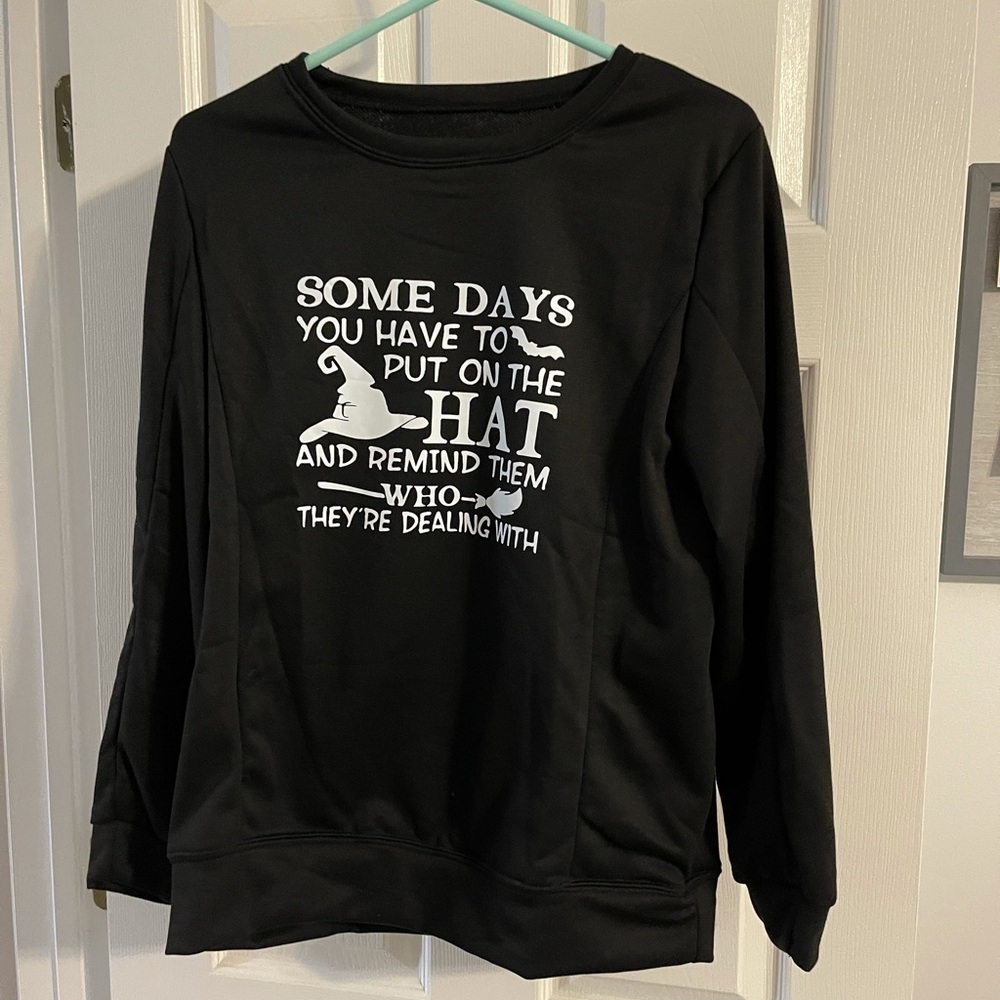 New black sweatshirt, long sleeves, round neck. XL